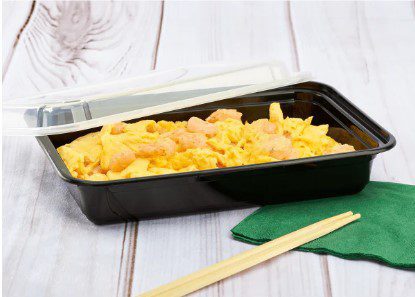 Takeout container with scrambled eggs and shrimp